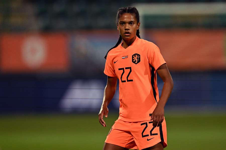 Brugts in het oranje shirt