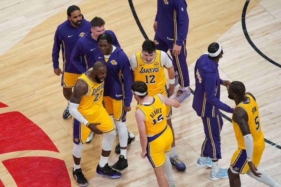 The Los Angeles Lakers celebrate winning a dramatic game in the NBA on Thursday. The Los Angeles Lakers celebrate winning a dramatic game in the NBA on Thursday.