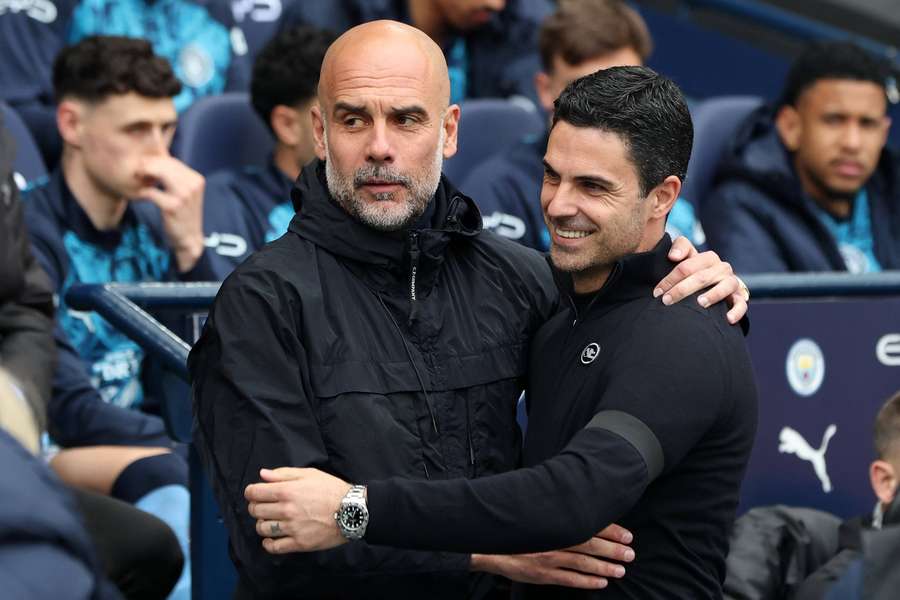 Manchester City manager Pep Guardiola greets Arsenal manager Mikel Arteta
