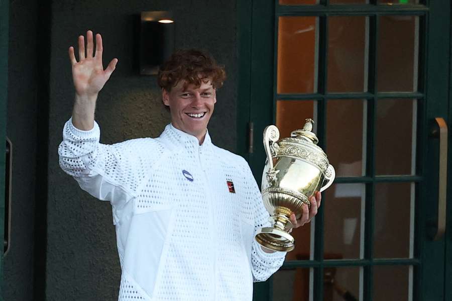 Jannik Sinner celebrates on the balcony with the trophy after winning the Wimbledon final Jannik Sinner celebrates on the balcony with the trophy after winning the Wimbledon final