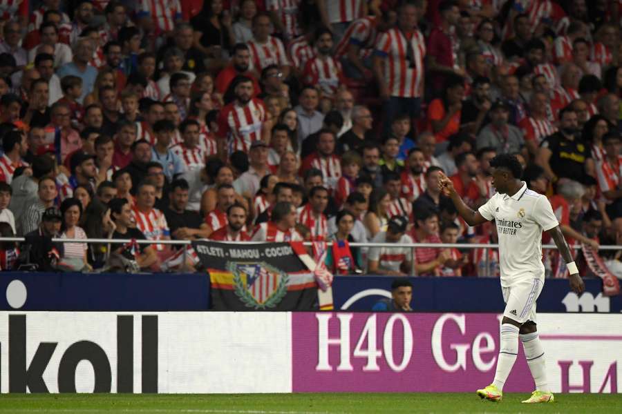 Real Madrid's Brazilian forward Vinicius Junior gestures toward the public during the match against Atletico Madrid.