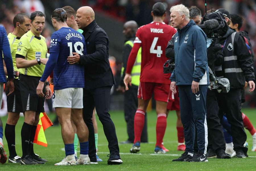 Arne Slot, David Moyes and Jack Grealish with the referee after the match