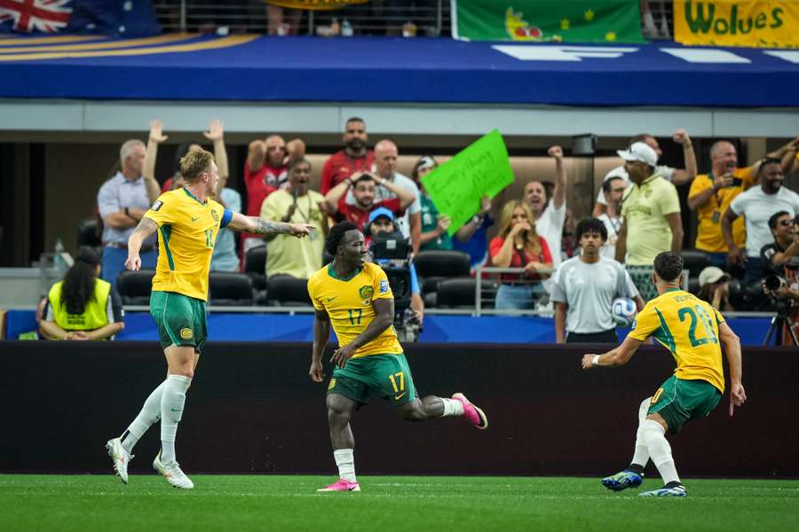 Nestory Irankunda celebrates a World Cup goal with teammates.