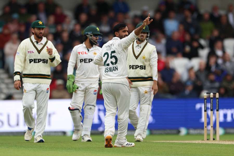 Pakistan's Ali Usman celebrates taking the wicket of England's Jordan Cox