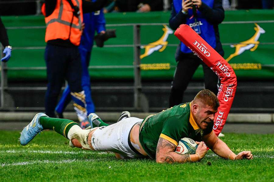 Malcolm Marx crosses the line in a 2024 Rugby Championship game against New Zealand.