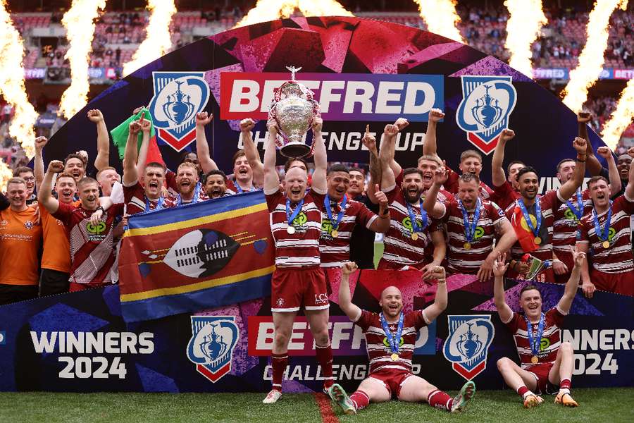 Wigan Warriors' Liam Farrell celebrates with the trophy after winning the Challenge Cup final