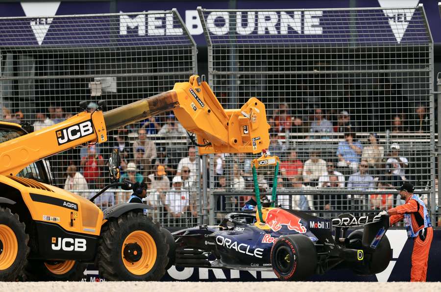 Verstappen's car is retrieved after his crash