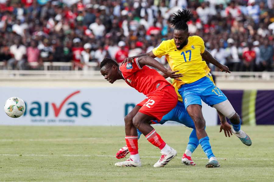 Gabon's Andre Poko plays against Kenya's Timothy Ouma