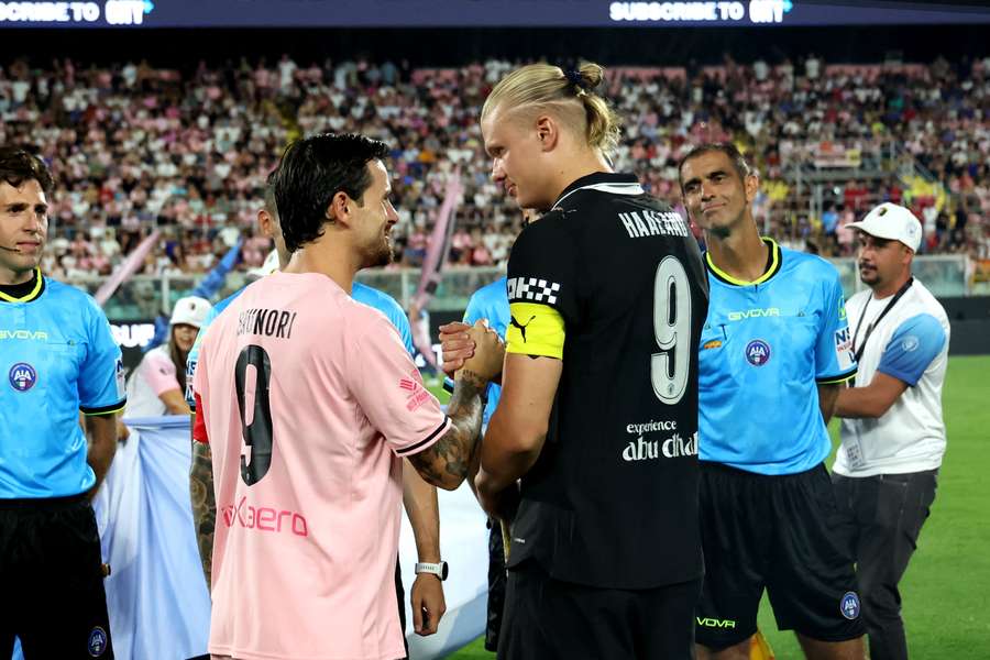 Matteo Brunori and Erling Haaland before the game