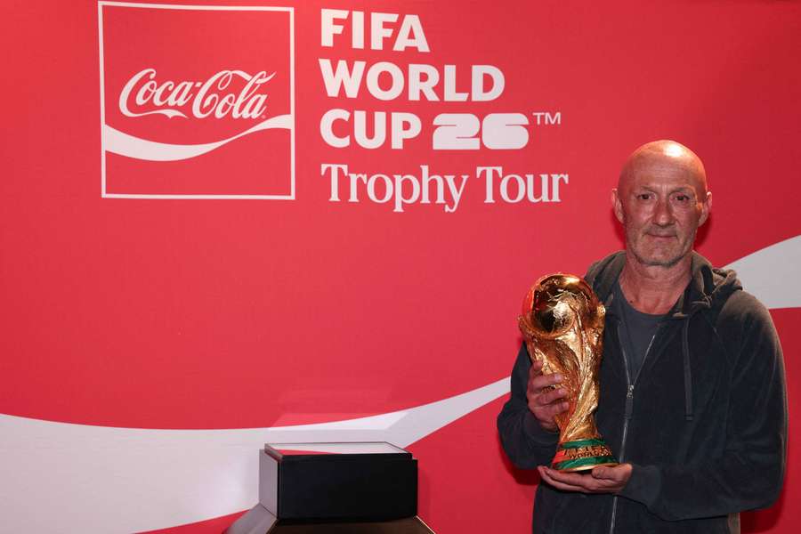 Fabien Barthez holds World Cup trophy at Adidas event