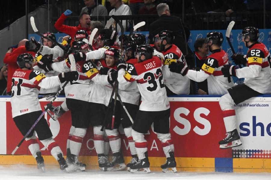 Austria's players celebrate after beating Finland 3-2