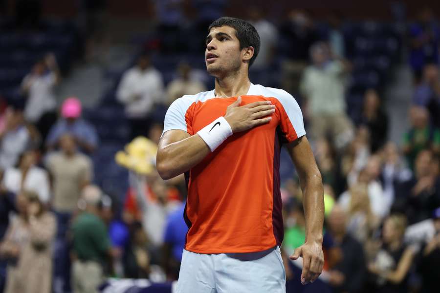 Carlos Alcaraz of Spain celebrates match point of his quarter-final against Jannik Sinner of Italy.