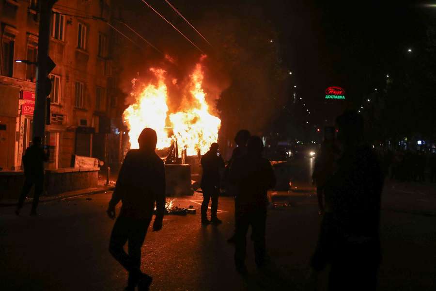 Protesters burn vehicles outside the Vassil Levski Stadium during the UEFA Euro 2024 Group G qualification football match between Bulgaria and Hungary