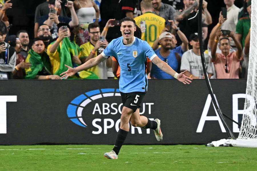 Manuel Ugarte celebrates after scoring in a penalty shoot-out to win