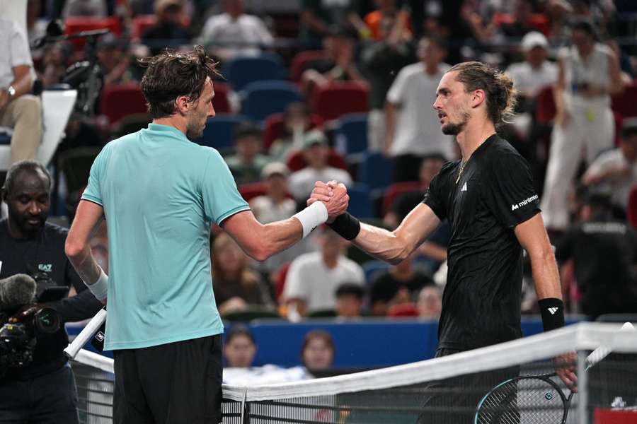 Arthur Rinderknech (left) greets Alexander Zverev after winning their men's singles match at the Shanghai Masters