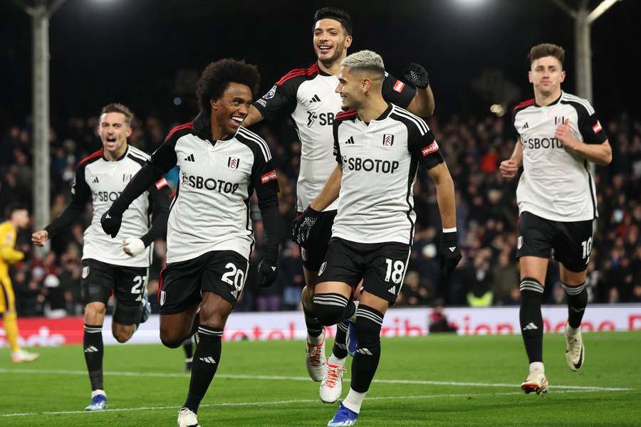 Willian celebrates scoring Fulham's second goal from the penalty spot