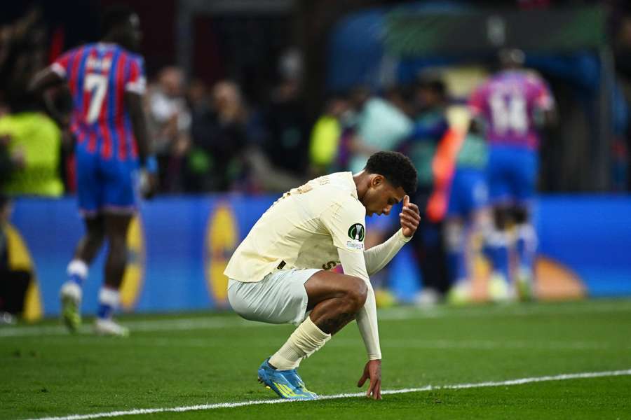 Pedro Henrique looks dejected after scoring an own goal
