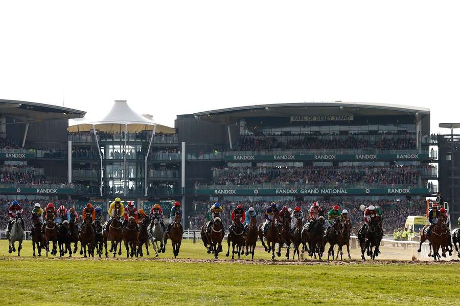 Horses and jockeys in action during the 17:15 Randox Grand National Handicap Chase