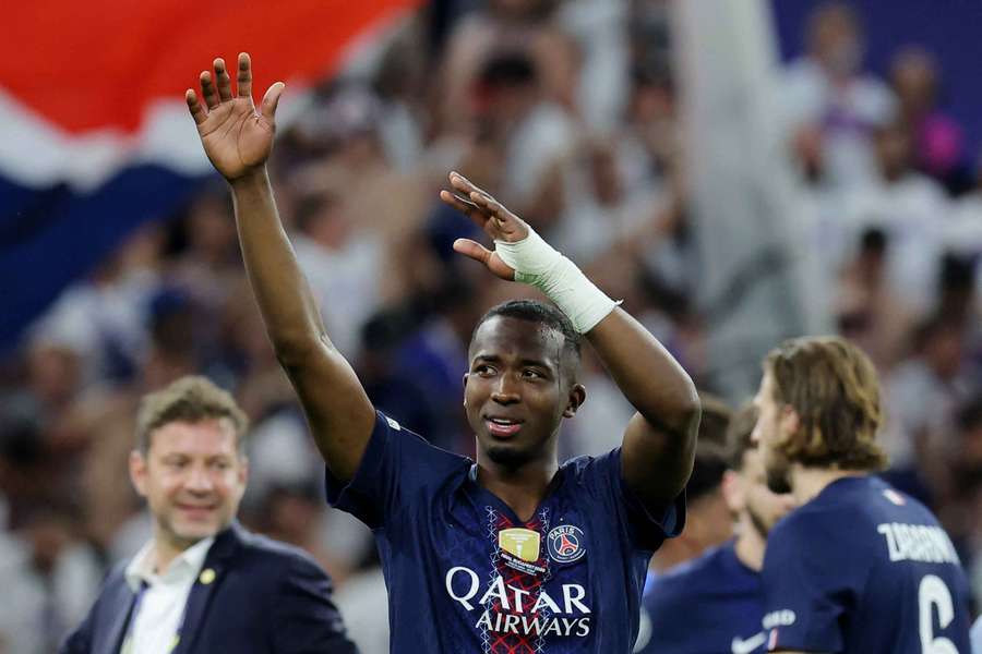 Pacho celebrates after winning the Champions League with PSG