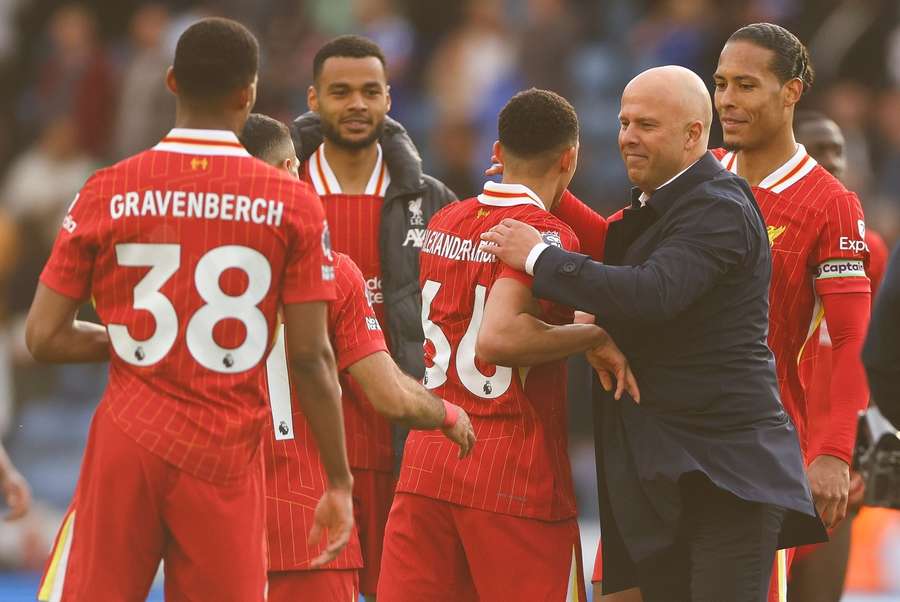 Liverpool manager Arne Slot hugs Trent Alexander-Arnold at full time after the game at Leicester City