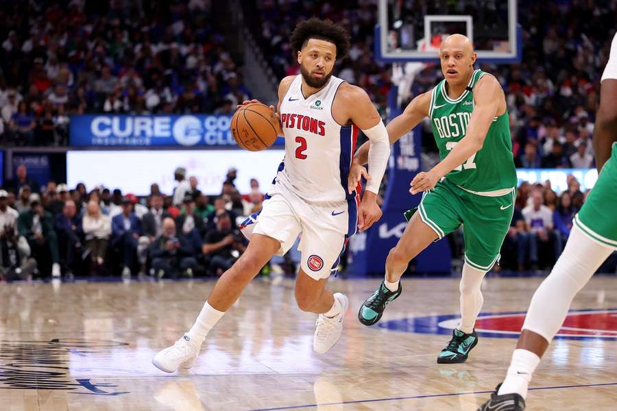 Pistons' Cade Cunningham handles the ball against the Boston Celtics during the 2026-27 NBA season opener
