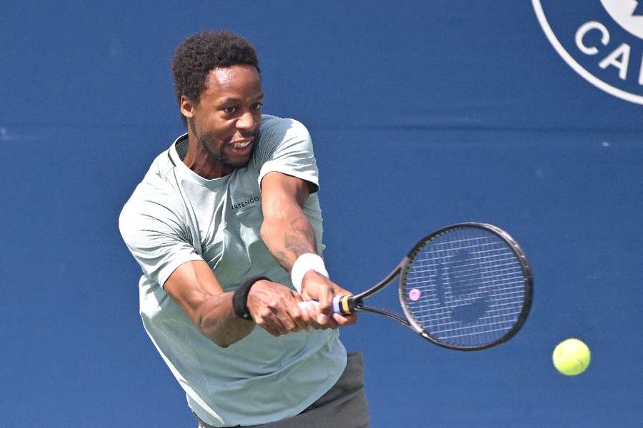 Gael Monfils plays a shot against Stefanos Tsitsipas in Toronto