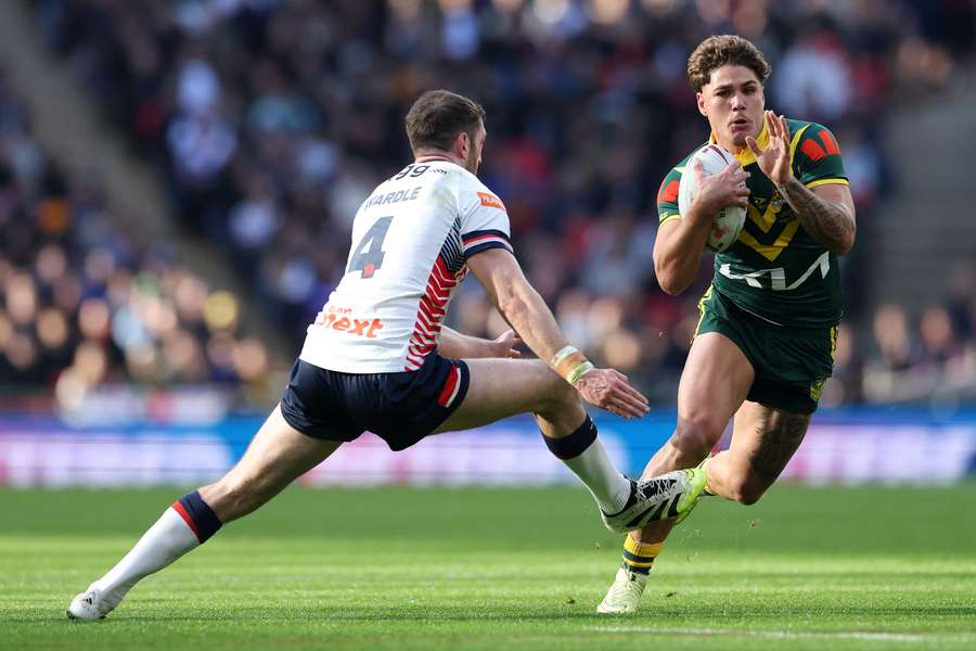Reece Walsh gets past England's Jack Wardle on the way to one of his two tries.  Reece Walsh gets past England's Jack Wardle on the way to one of his two tries.