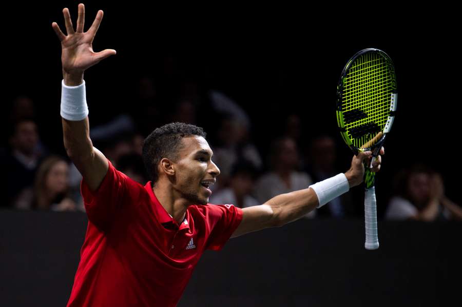 Felix Auger-Aliassime celebrates after winning the men's double semi-final tennis of the Davis Cup