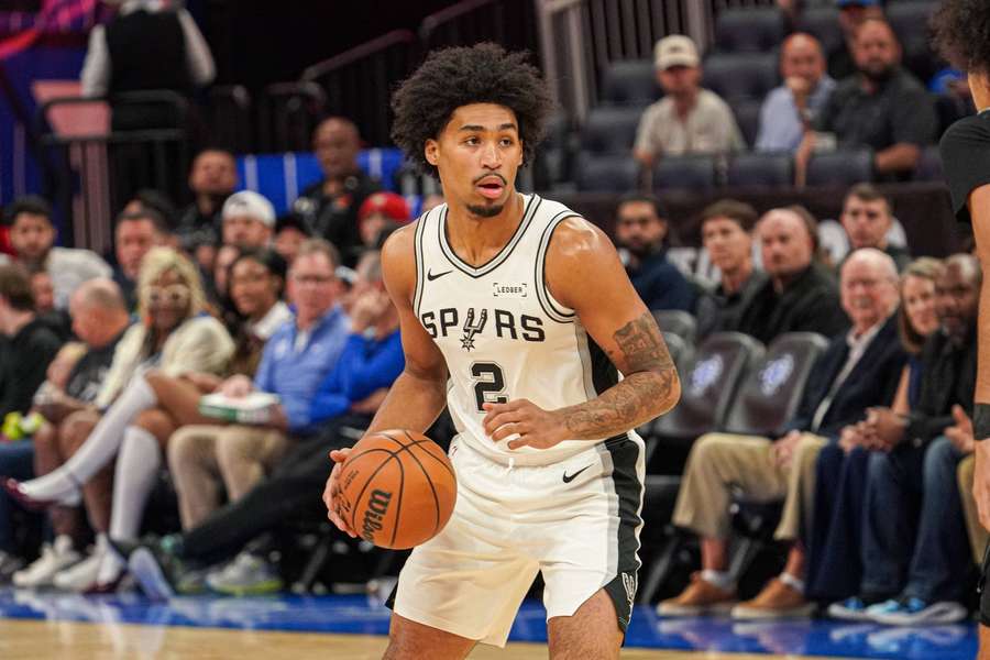 San Antonio's Dylan Harper looking to pass while competing against the Orlando Magic San Antonio's Dylan Harper looking to pass while competing against the Orlando Magic