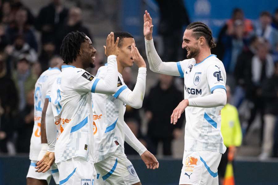Marseille scored three first-half goals to control the game