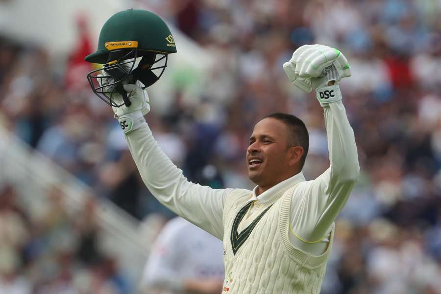 Australia's Usman Khawaja celebrates after reaching his century during play on day two of the first Ashes cricket Test match