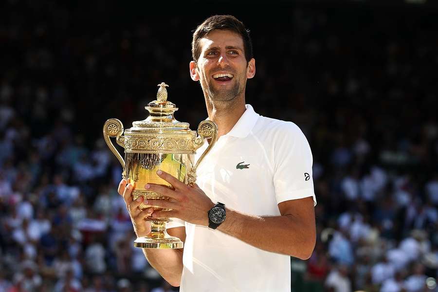 Novak Djokovic with the Wimbledon trophy after winning the 2018 final