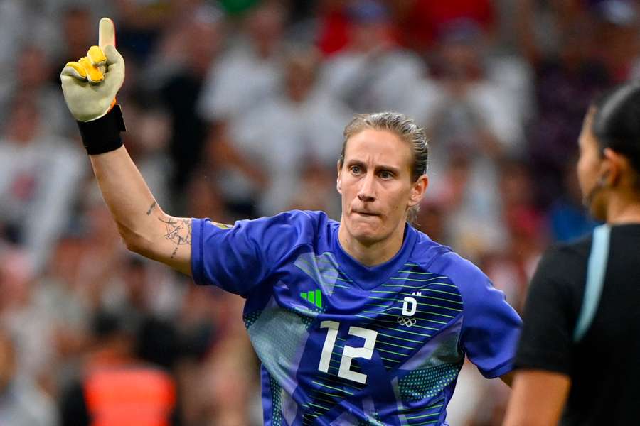 Germany's goalkeeper Ann-Katrin Berger celebrates their victory after the penalty shootout against Canada