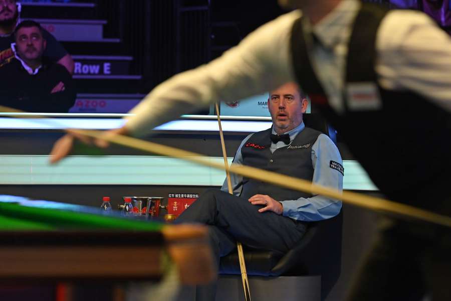 Wales' Mark Williams looks on from his seat during the Masters snooker tournament final against England's Judd Trump at Alexandra Palace