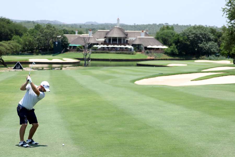 Andy Sullivan of England plays his second shot on the ninth hole