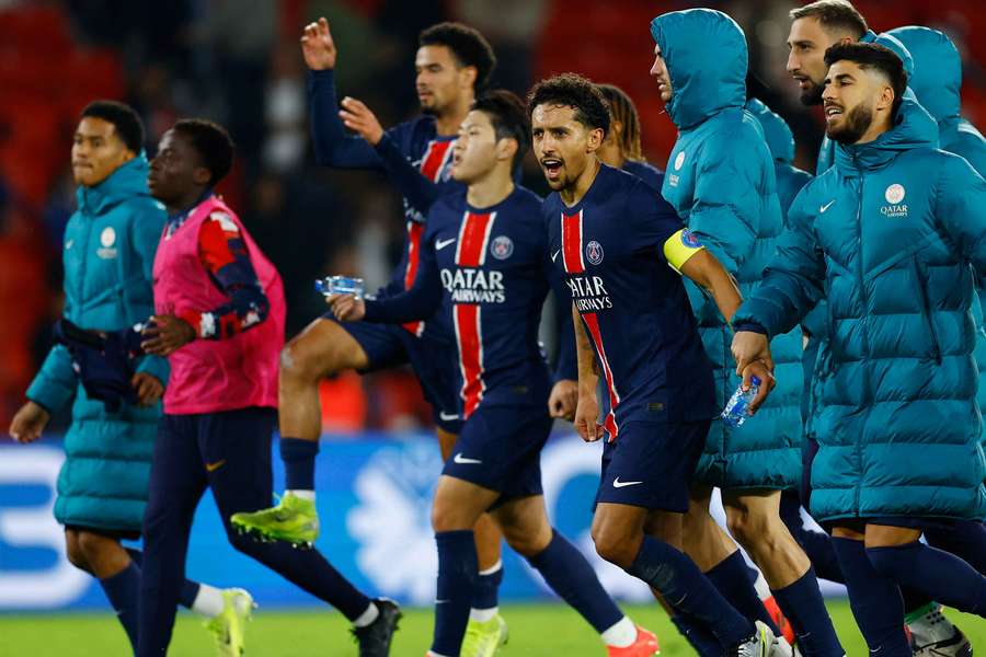 PSG players celebrate together 