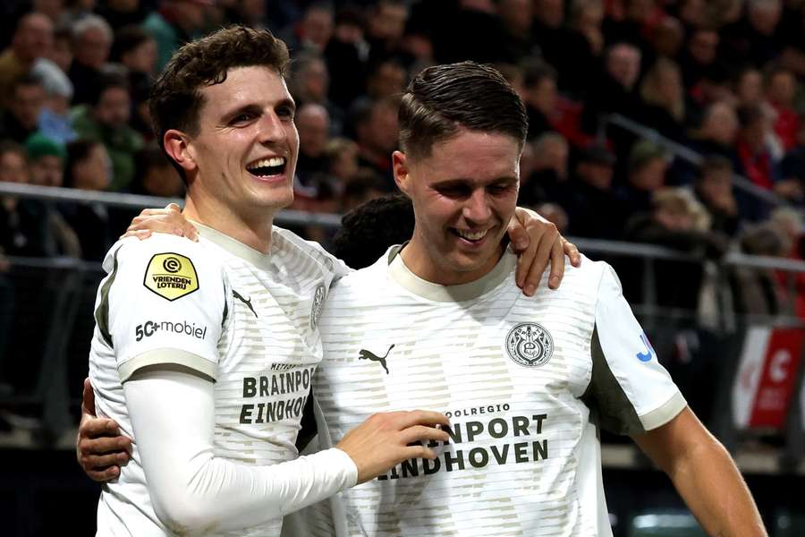 PSV's Guus Til (L) and Joey Veerman celebrate a goal away at AZ