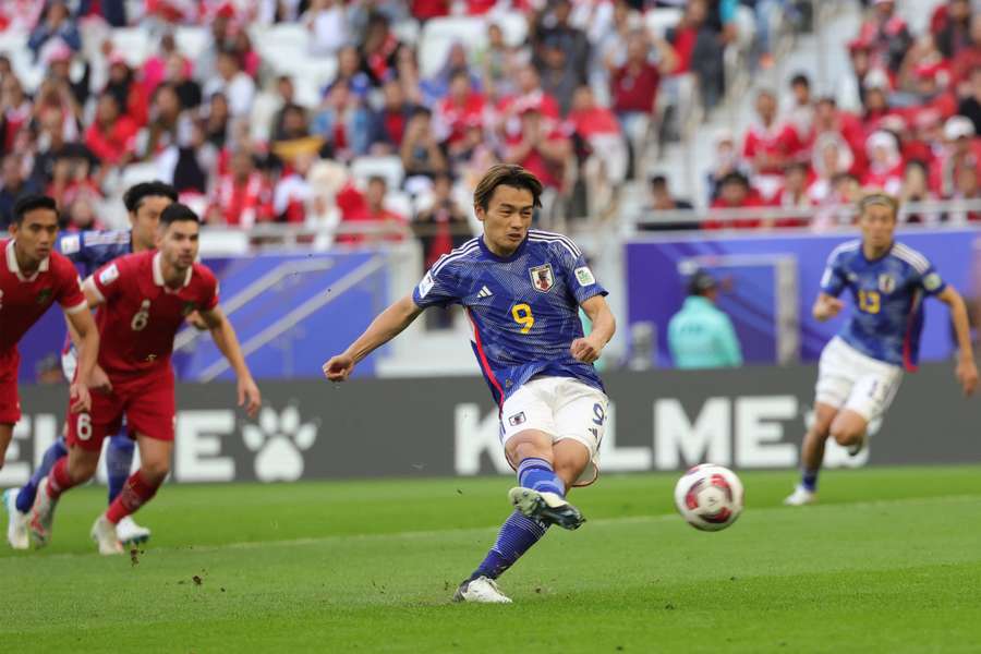 Japan beat Indonesia at the Asian Cup in Doha to move into the knockout rounds