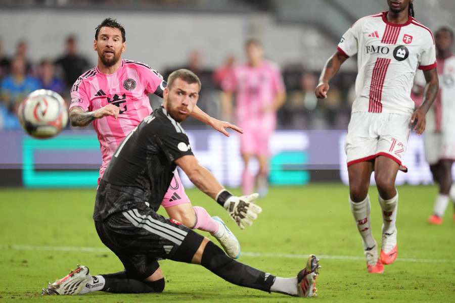 Lionel Messi slots one past Lionel Messi (10) scores a goal past Toronto FC goalkeeper Luka Gavran.