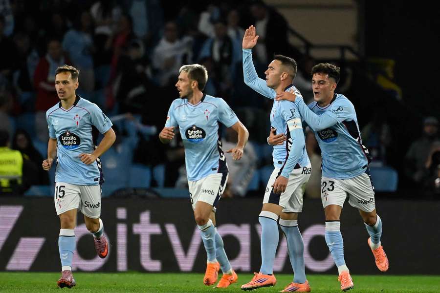 Aspas celebrates his equaliser with teammates