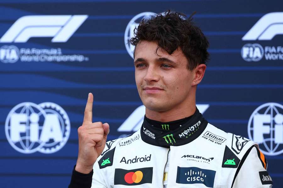 McLaren's Lando Norris celebrates after qualifying in pole position