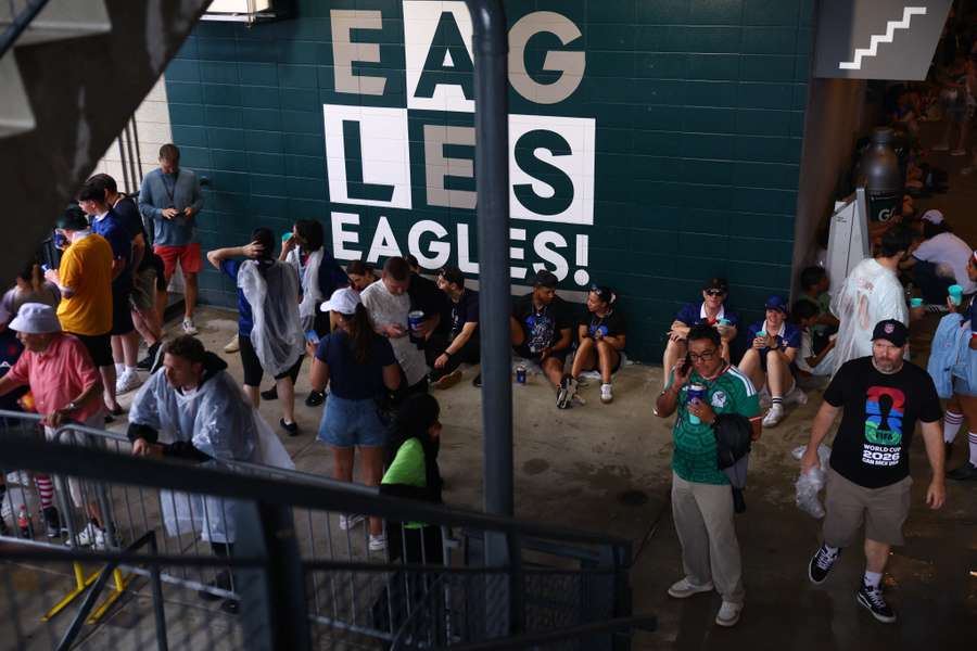 Spectators taking cover at Philadelphia Stadium. Spectators taking cover at Philadelphia Stadium.
