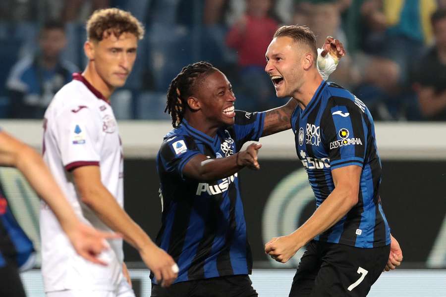 Koopmeiners, right, celebrates one of his three goals to see off Torino in Bergamo