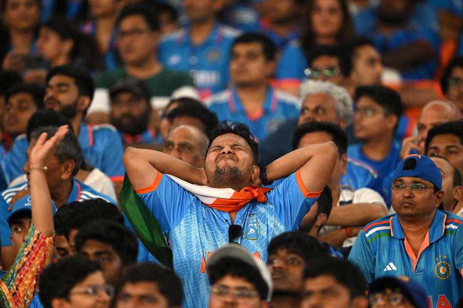 India fans react while watching the World Cup final
