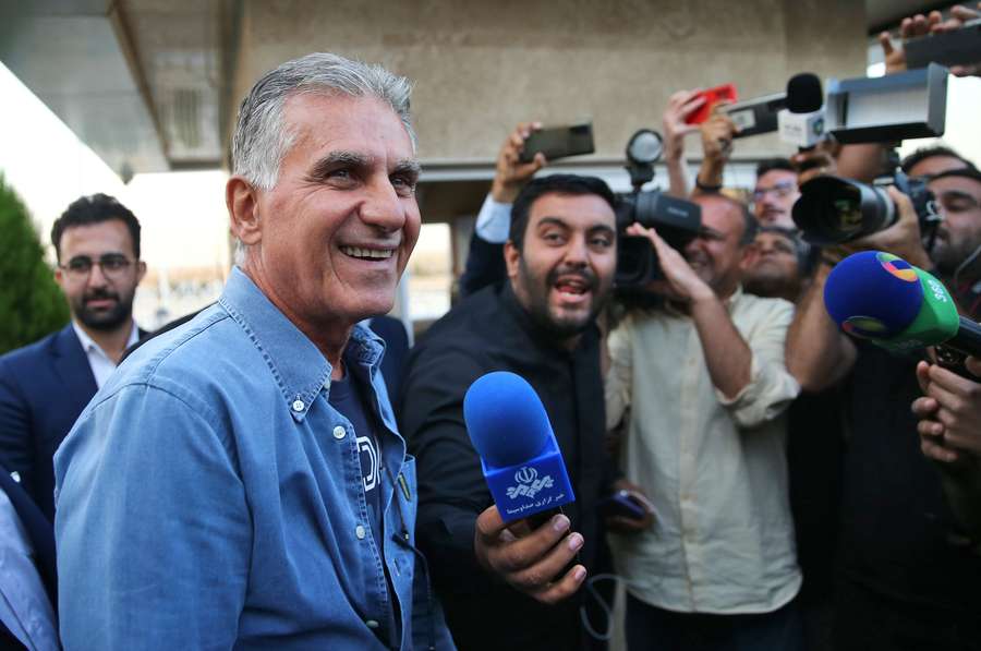 The new Portuguese coach of the Iranian football team, Carlos Queiroz, smiles as he arrives at the Imam Khomeini Airport in Tehran.