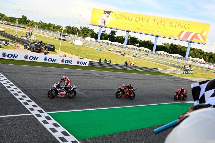 Riders cross the finish line at the Thai Grand Prix