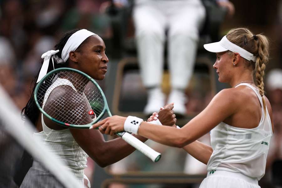 Dayana Yastremska shakes hands with Coco Gauff at the end of their match