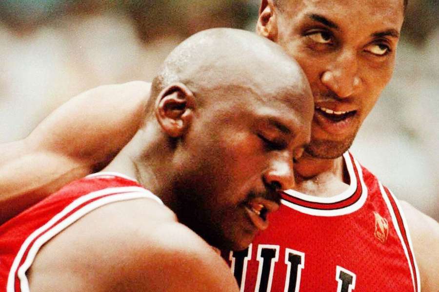 The Chicago Bulls' Michael Jordan falls into the arms of teammate Scottie Pippen during his famous 'Flu Game' in 1997