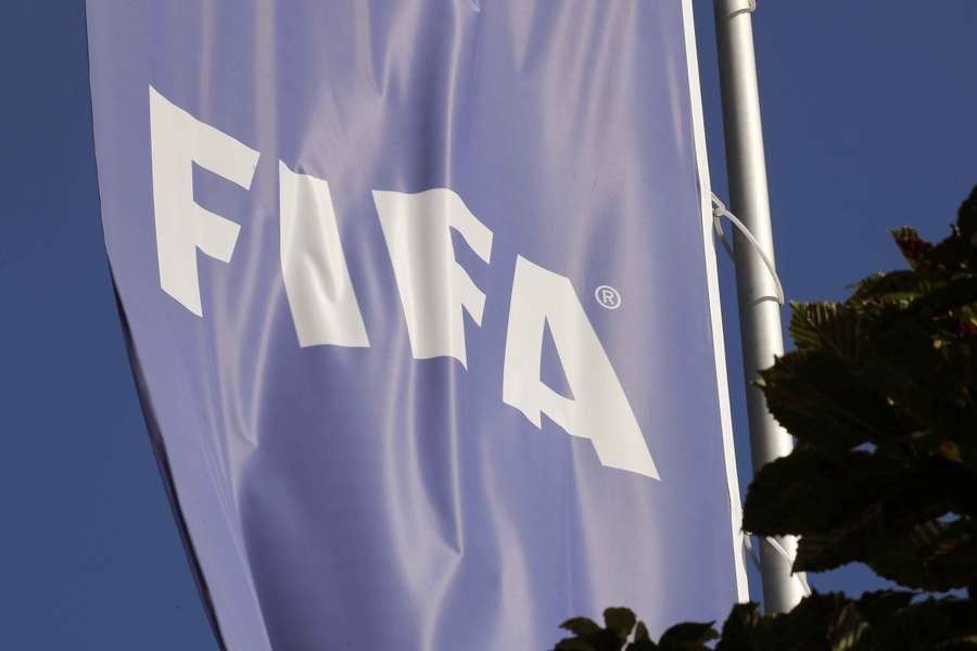 A flag with the logo of FIFA flies in front of its headquarters in Zurich