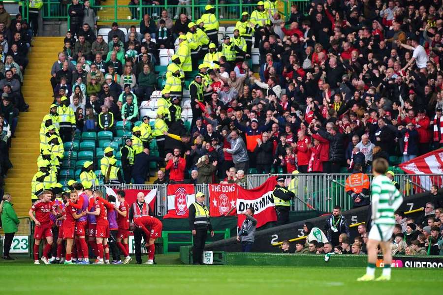 Aberdeen's players celebrate in front of their fans